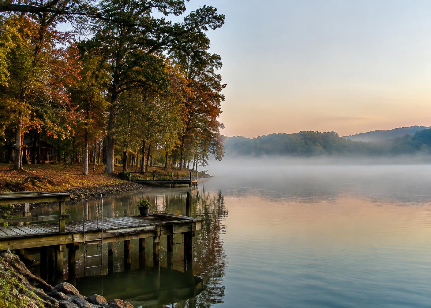 Photorealistic editorial interpretation illustrating Concord vs. Lake Norman in the Concord area